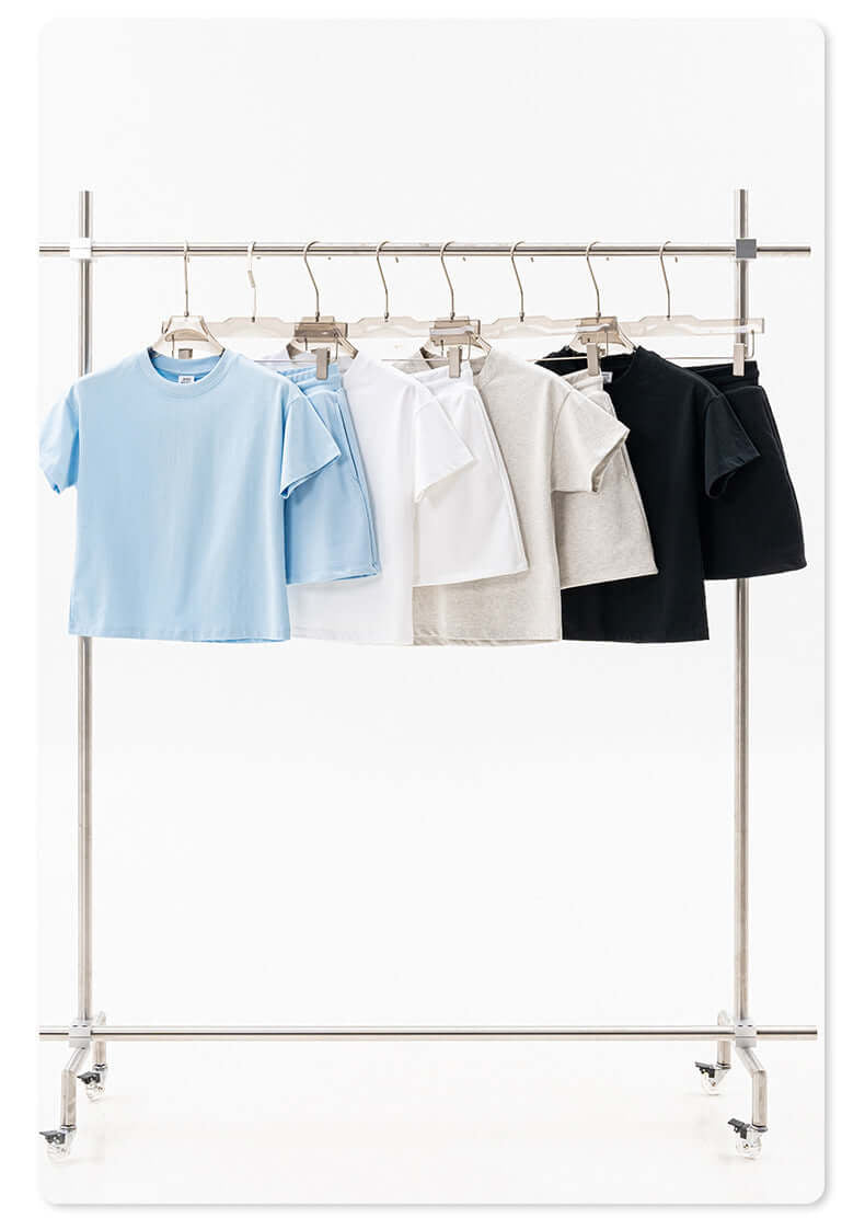 Multi-colored t-shirts and skirt on rack