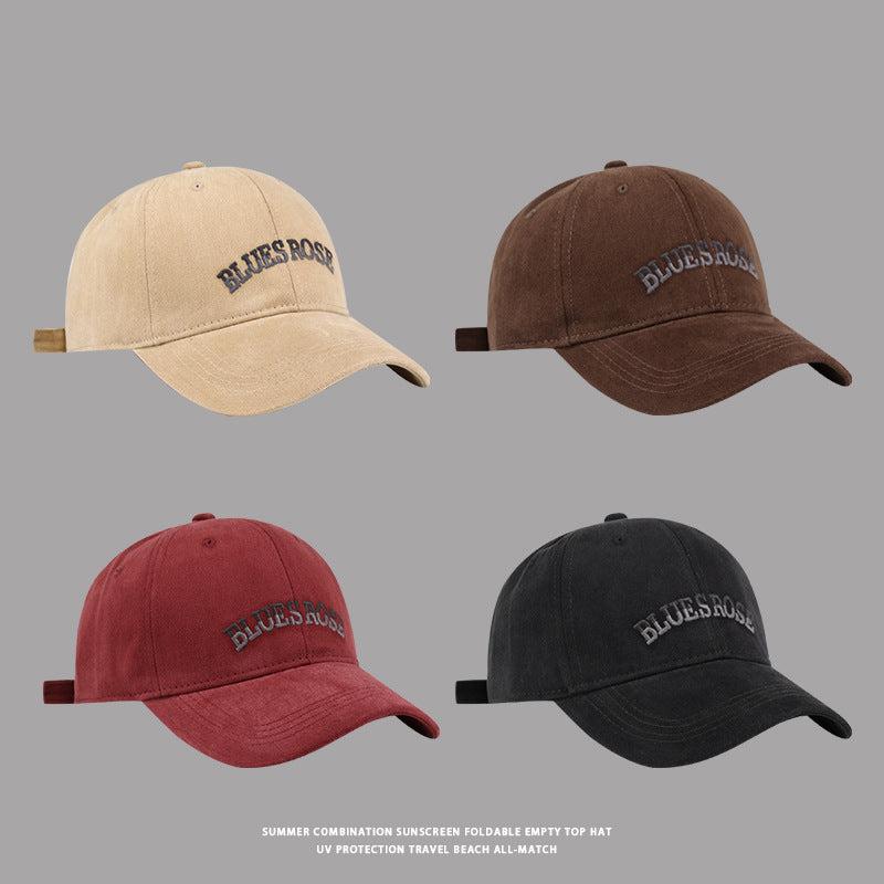 BluesRose embroidered baseball caps in beige, brown, red, and black, featuring a curved brim and adjustable strap