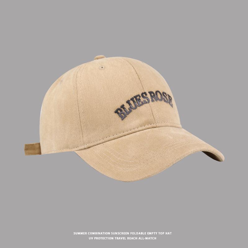 Light brown BluesRose baseball cap with embroidered text, curved brim, and vintage washed finish