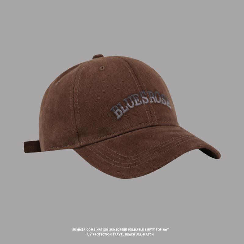 Brown BluesRose embroidered baseball cap with a curved brim and soft washed fabric for a retro aesthetic