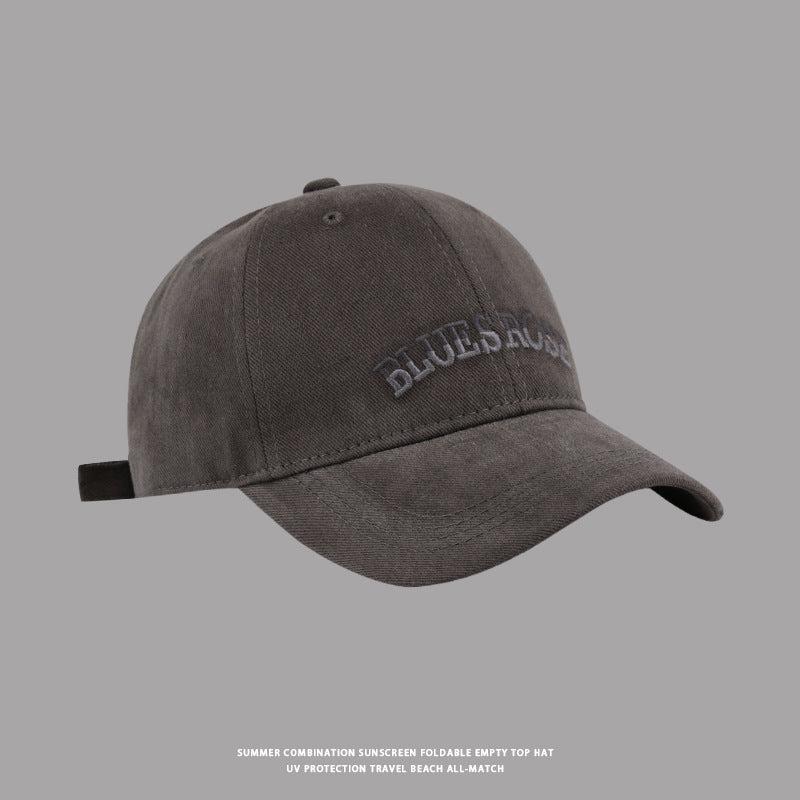 Dark gray BluesRose baseball cap with embroidered text, classic curved brim, and adjustable strap