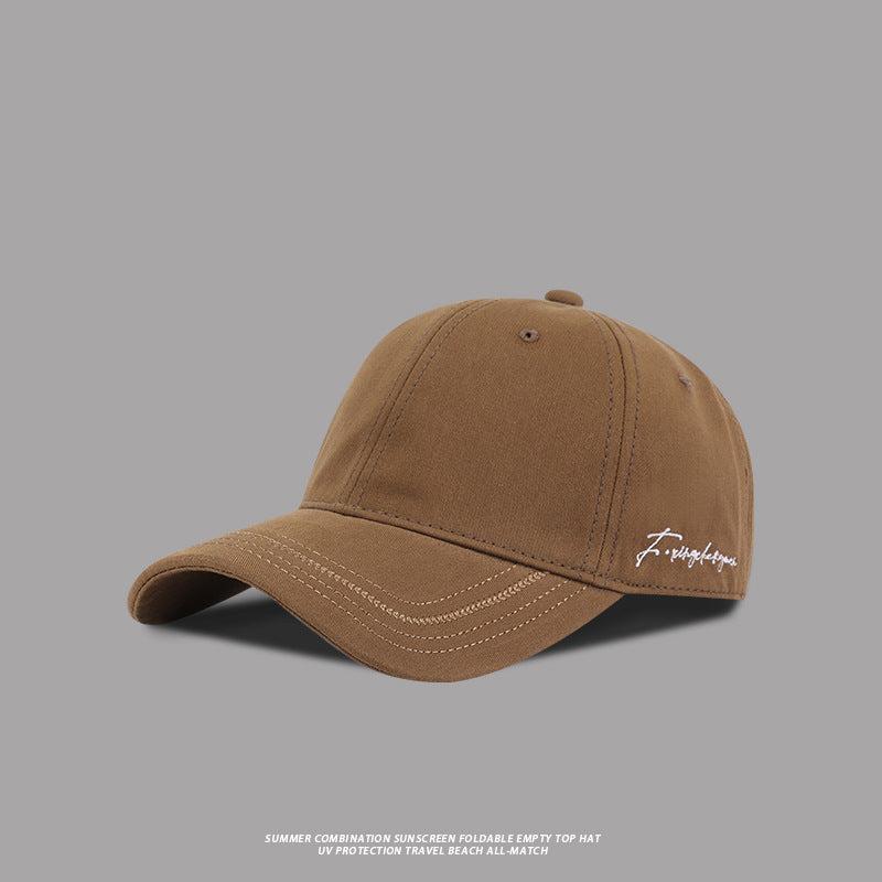 Tan baseball cap with embroidered signature logo, durable and adjustable