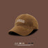 Tan baseball cap with white COLORADO embroidery displayed against brown background with color options and UV protection features