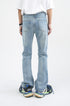 Distressed light blue wide-leg denim jeans with faded vintage wash