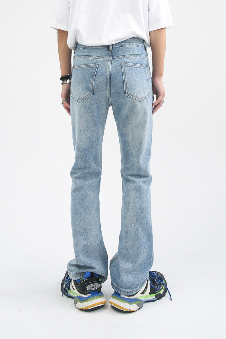 Distressed light blue wide-leg denim jeans with faded vintage wash