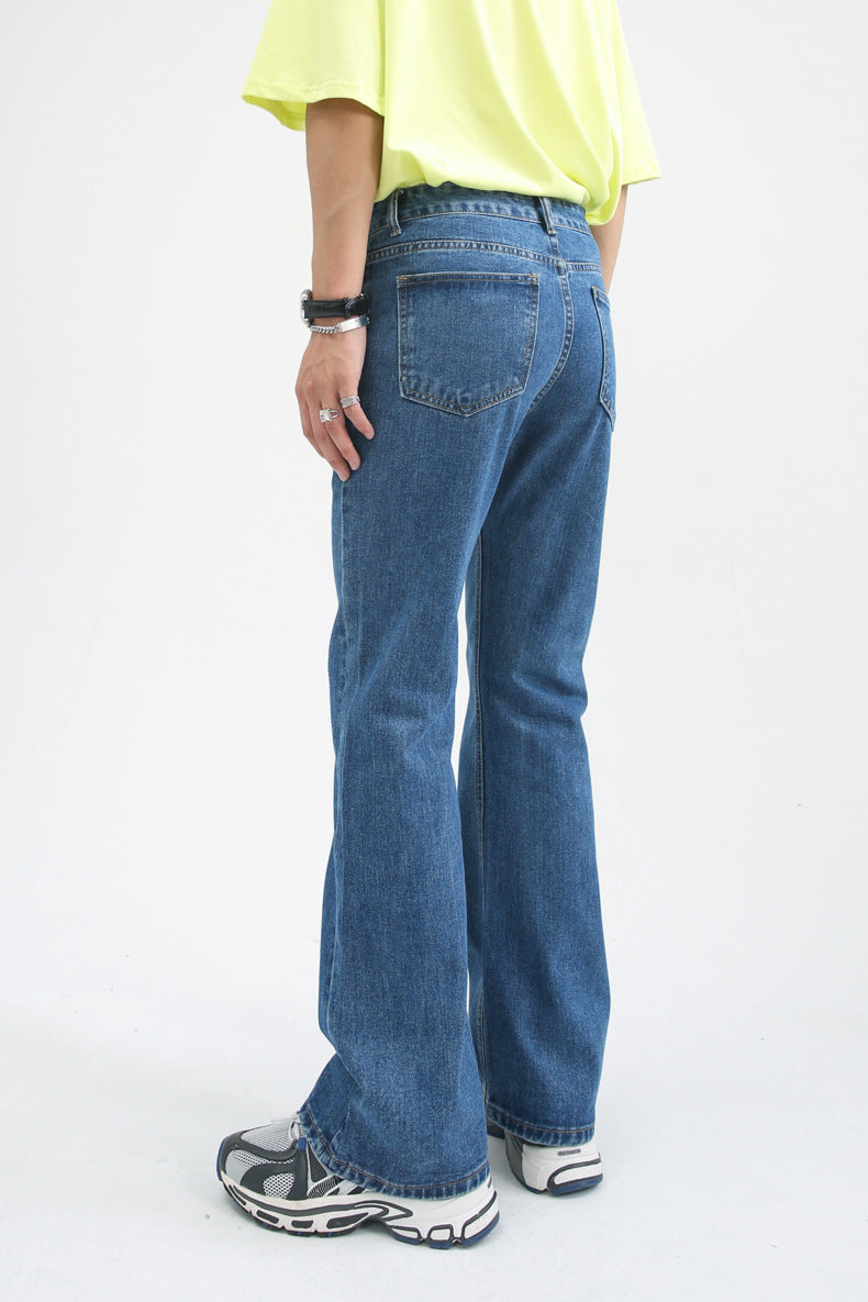 Worn-in blue denim jeans with relaxed fit and slight distressing