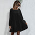 Black long-sleeve babydoll dress with square neckline, showcasing modern minimalist style for versatile wear