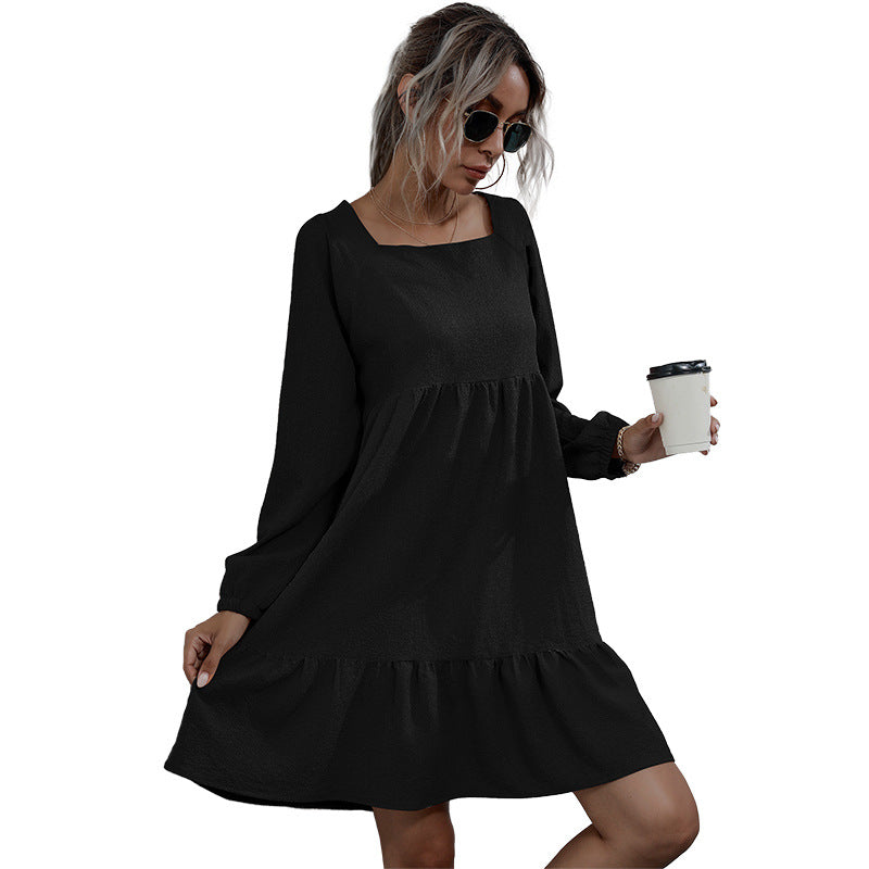 Black babydoll dress with long sleeves and ruffle hem, perfect for casual and chic styling