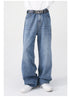 A front view of blue wide-leg jeans worn with a black "NOT" belt, a white shirt, and white sneakers, showcasing the relaxed fit
