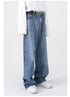 A side view of blue wide-leg jeans with a high waist and a "NOT" belt, paired with a white shirt and white sneakers