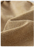 A close-up of the beige fabric, emphasizing the soft, textured weave and natural color variations