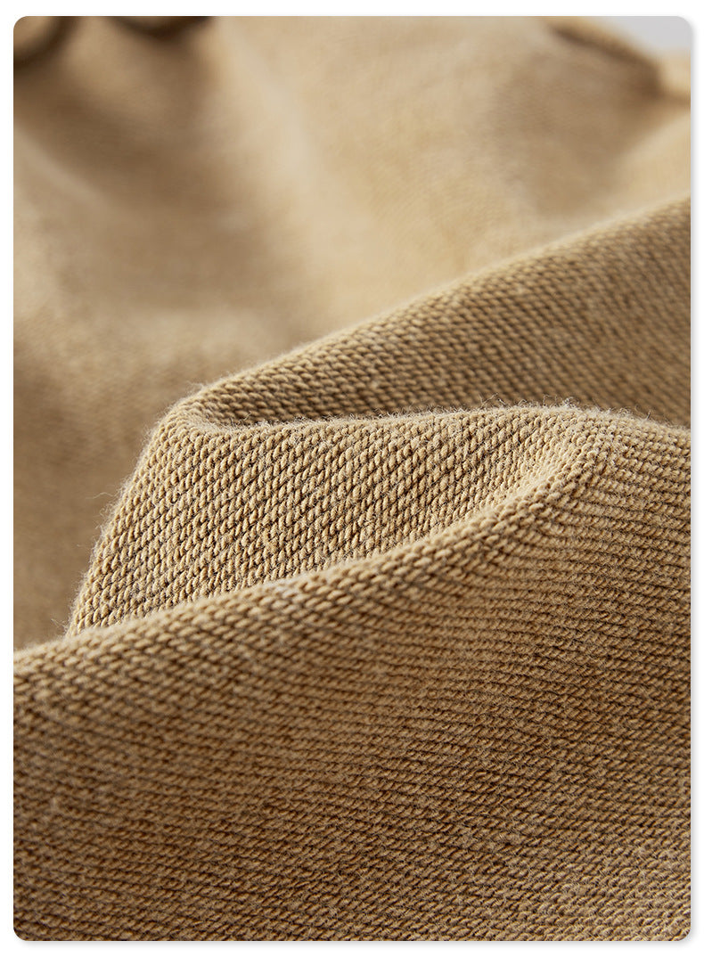 A close-up of the beige fabric, emphasizing the soft, textured weave and natural color variations