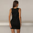 A woman showing back view of sleek black mini dress with ruched sides and sleeveless design against neutral wall