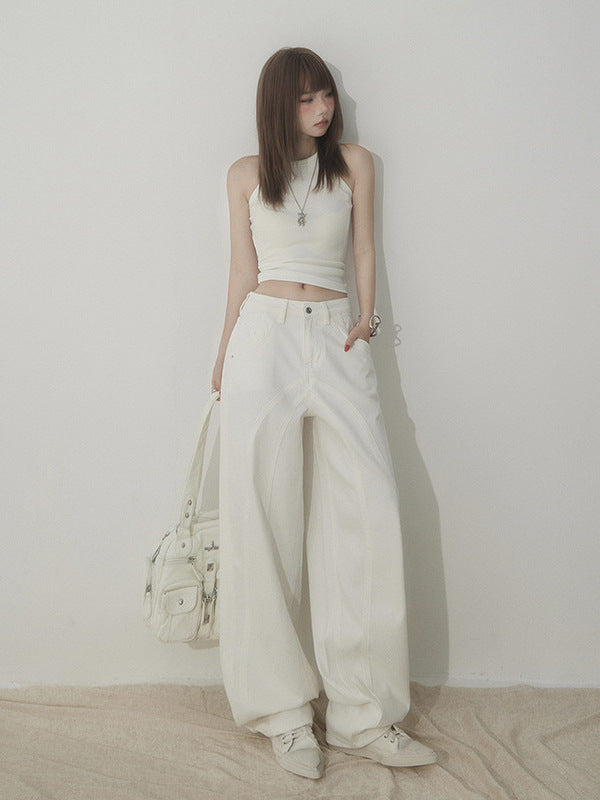 Angled front view of high waist white wide-leg jeans paired with sleeveless crop top.