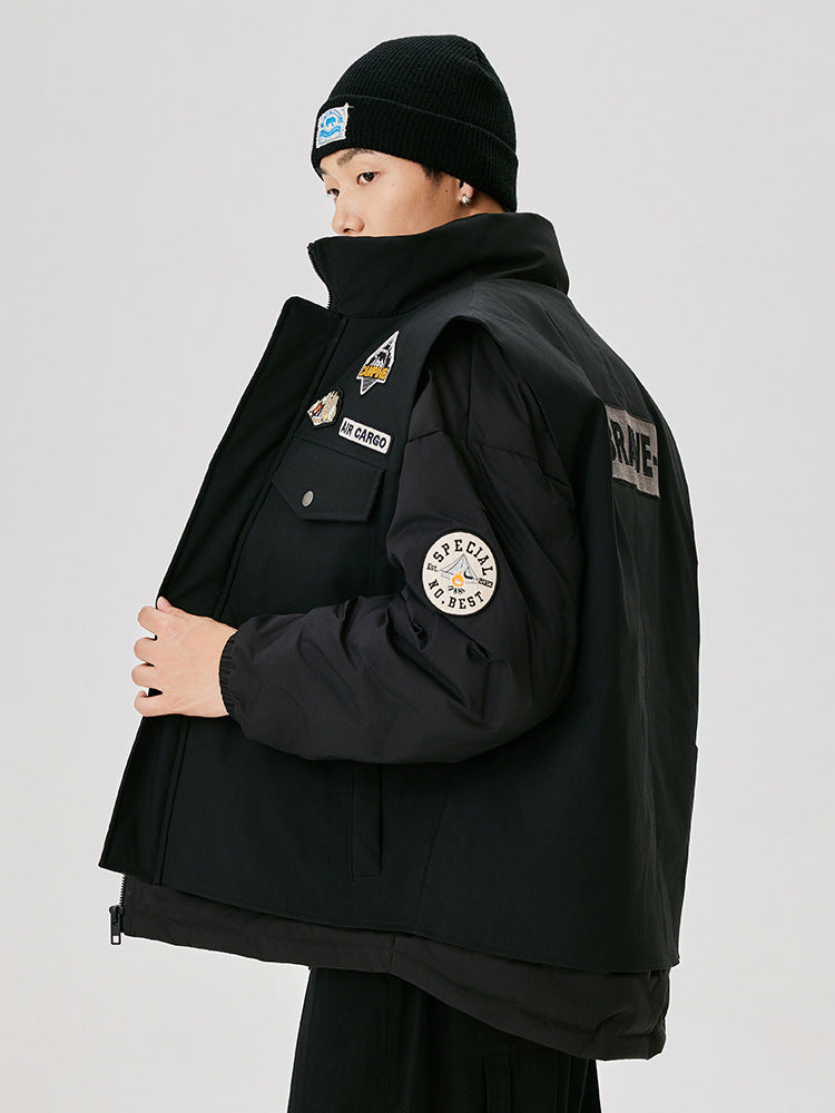 Three-quarter view of black winter coat with multiple decorative patches, flap pockets and ribbed cuffs