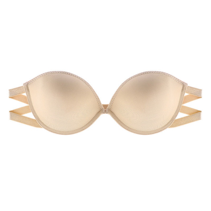 Close-up of nude beige strapless bra with multiple straps and textured edges