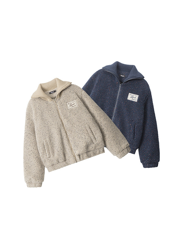 Product flat lay showing beige and navy sherpa jackets with Marule logo patches and ribbed collars. Available in two color options