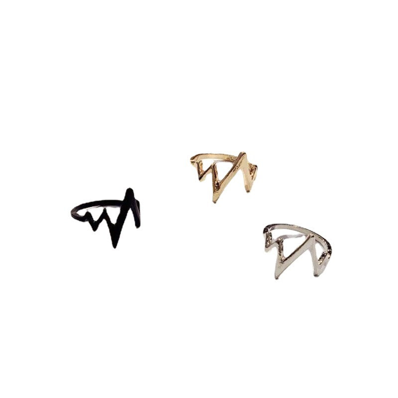 Three lightning bolt rings displayed on white background - black, gold, and silver versions