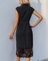 Back view of a black sleeveless midi dress with lace hem, a defined waist, and a classic collar, highlighting the elegant silhouette.
