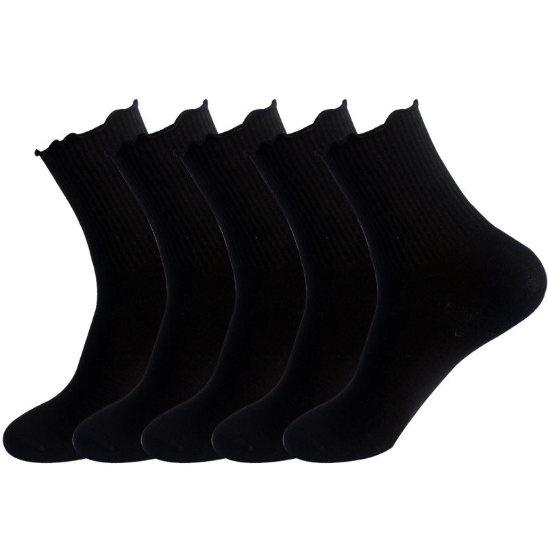 Five pairs of black ankle socks with ribbed cuffs and scalloped edges displayed side by side against white background