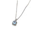 Close-up product shot of blue crystal pendant with cubic zirconia halo and silver chain against white background