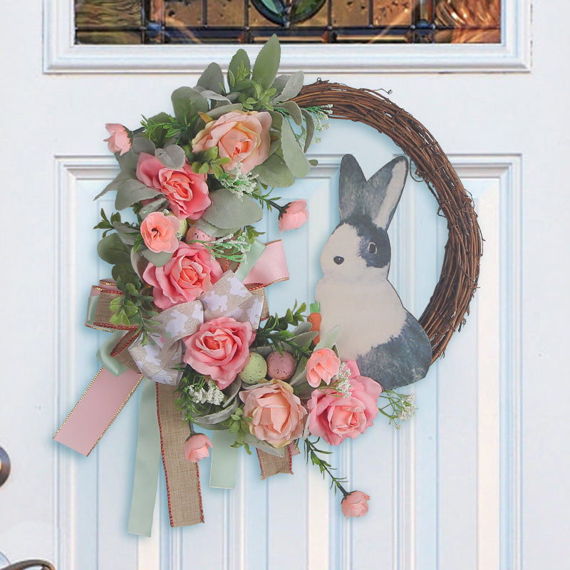 A pastel-colored floral wreath with a rabbit centerpiece, ideal for farmhouse spring decor.