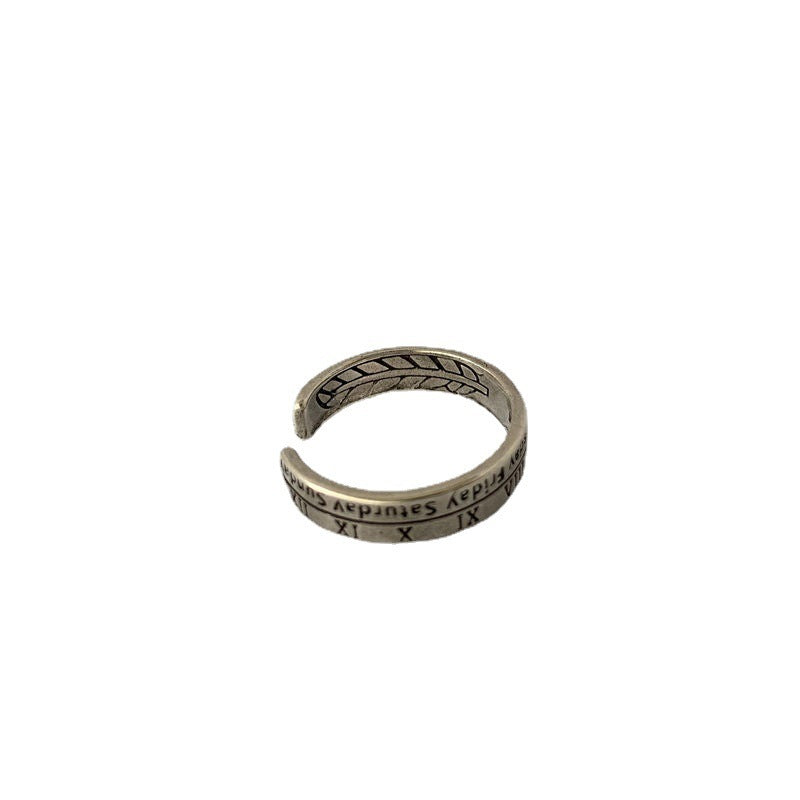 A vintage-style silver adjustable ring with Roman numerals and inscriptions displayed against white background