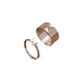 Silver butterfly rings shown together: wide cutout band and thin band with raised butterfly design