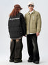 Models wearing coordinated ASTROSMASH puffer jackets - one showing back logo text, with wide-leg pants and sunglasses