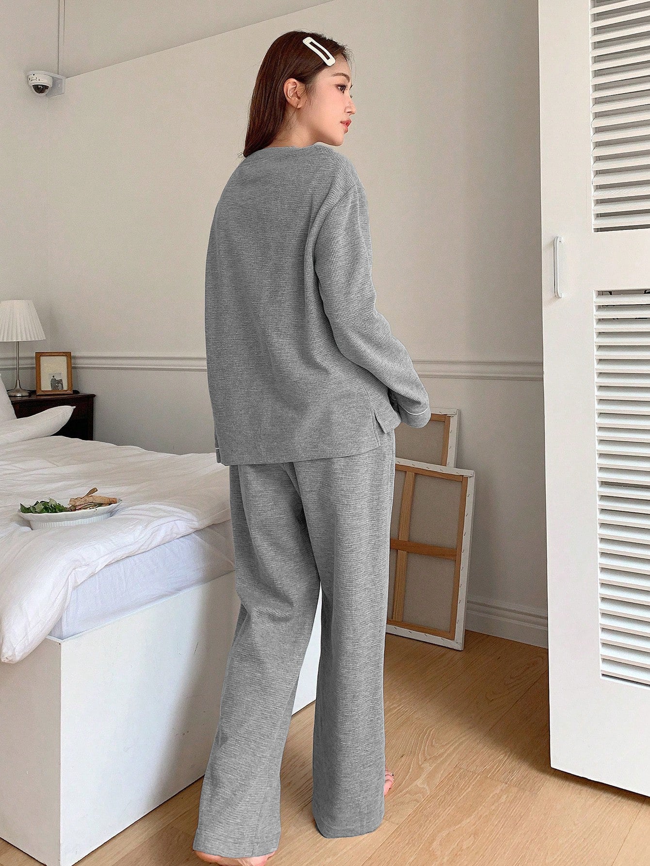 Back view of gray loungewear set showing relaxed fit and wide-leg pants silhouette