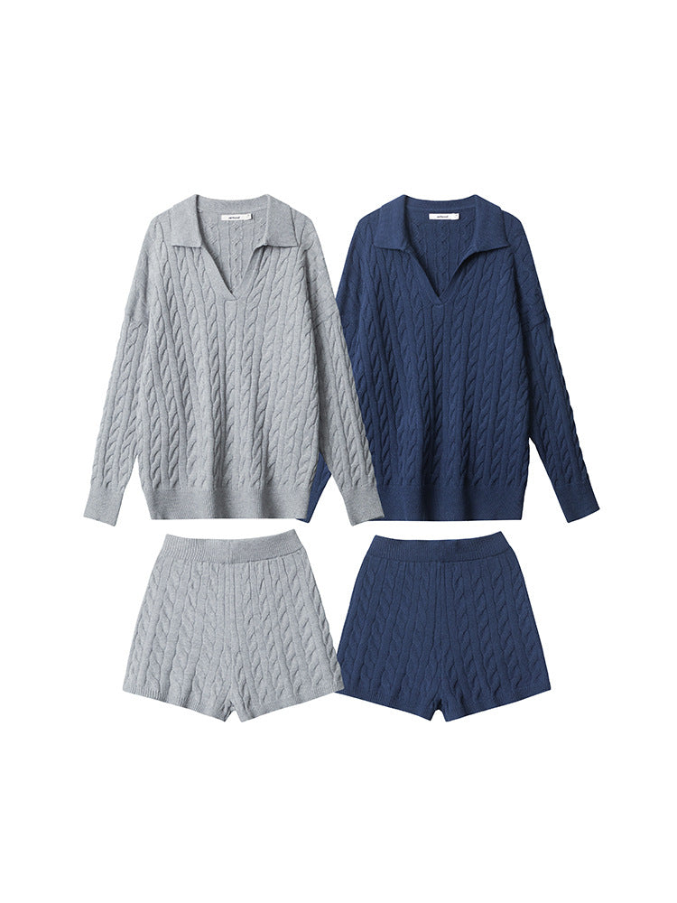 Cable knit two-piece sets in grey and navy. V-neck polo collar sweaters with matching knit shorts, featuring all-over cable pattern.