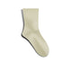A single cream colored crew sock displayed against white background, showing smooth seamless construction and mid-calf length