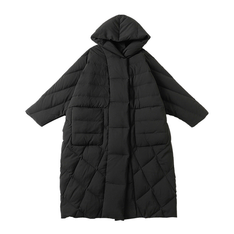 Flat lay product shot of black hooded puffer coat displaying quilted pattern and large patch pockets on white background