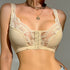 Beige lace-trimmed bralette with front closure detail, styled with gold chain necklace against gray background