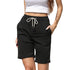Black bermuda shorts with white crop top, highlighting comfortable athletic style