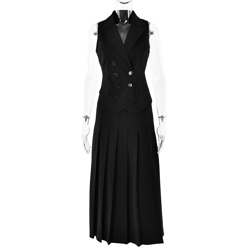 A black sleeveless double-breasted vest and pleated midi skirt displayed on transparent mannequin against white backdrop