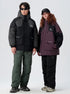 Two models standing together wearing All Drifting technical jackets - black with gray panels and plum with black panels on white background
