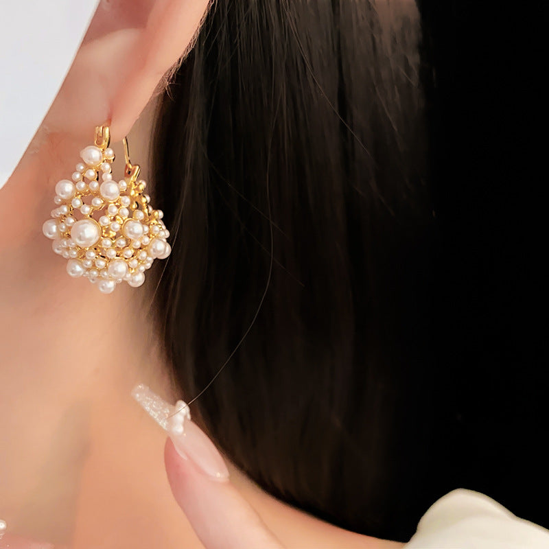 Elegant pearl cluster earrings with gold metalwork