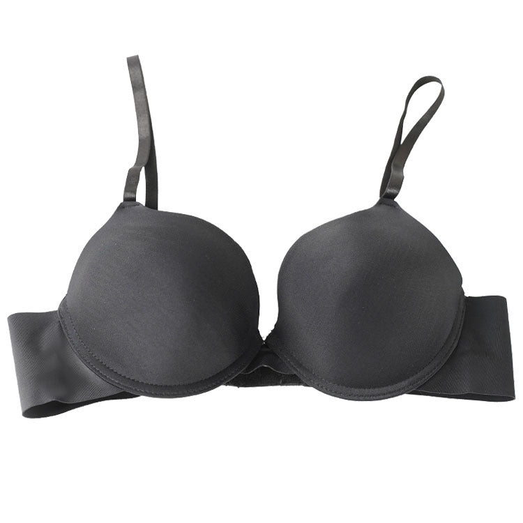 Black push-up bra with molded cups and adjustable straps on white background