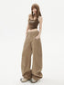 Side view, hands-in-pocket pose showing relaxed wide-leg silhouette.
