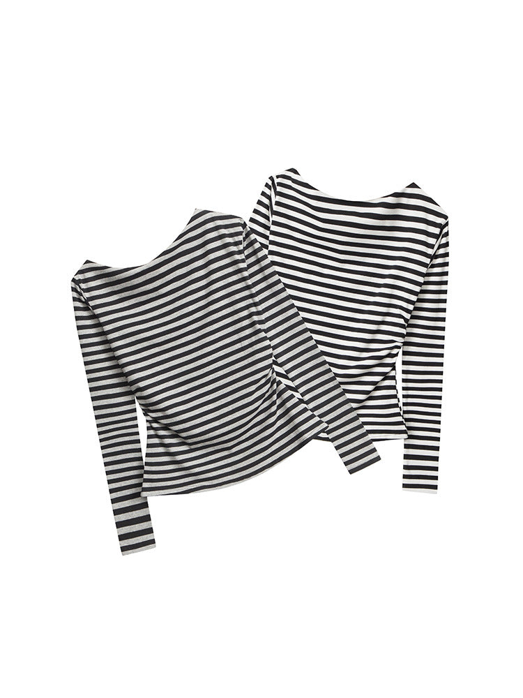 Black and white striped long-sleeve tops, flat lay