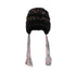 Detailed view of beige fuzzy winter hat with multicolored speckles, braided earflaps, and textured knit fabric