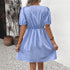 The back view of the blue striped dress, showcasing the elastic waistband and puff sleeves.