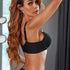 Side angle product shot highlighting black bra's adjustable strap design and molded cup construction