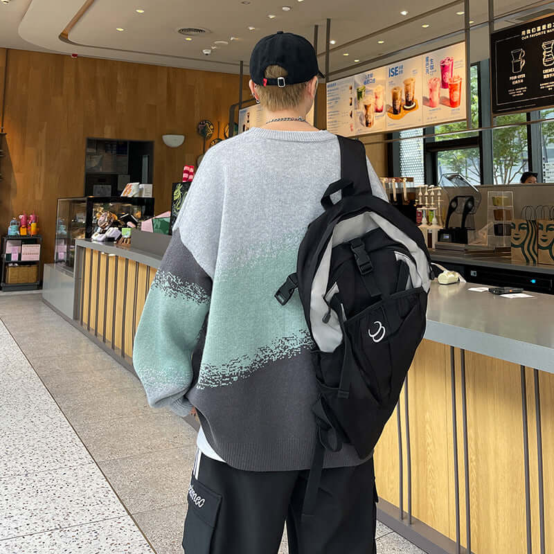 Back view of grey-mint-charcoal gradient sweater