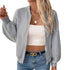 Gray zip-up jacket with white tube top, model wearing gold accessories