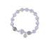 Full view of moonstone bracelet with silver details and crystal-filled pendant charm