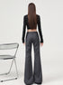 Back view, full-body shot of gray flared dress pants with curve-hugging fit.