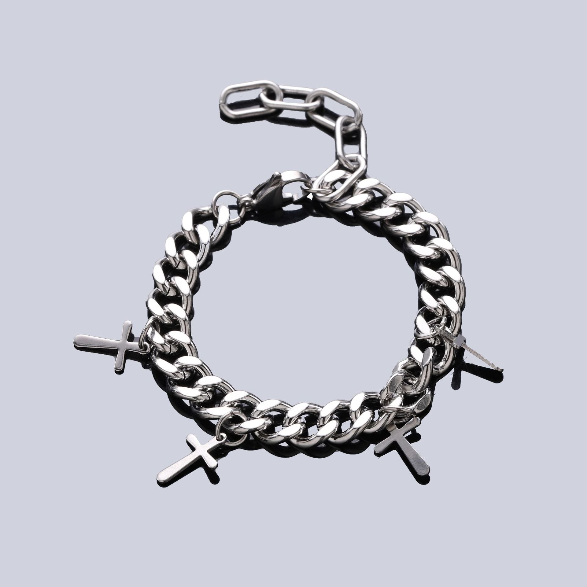 Adjustable silver chain bracelet with cross pendants, featuring a modern and versatile design for everyday wear.