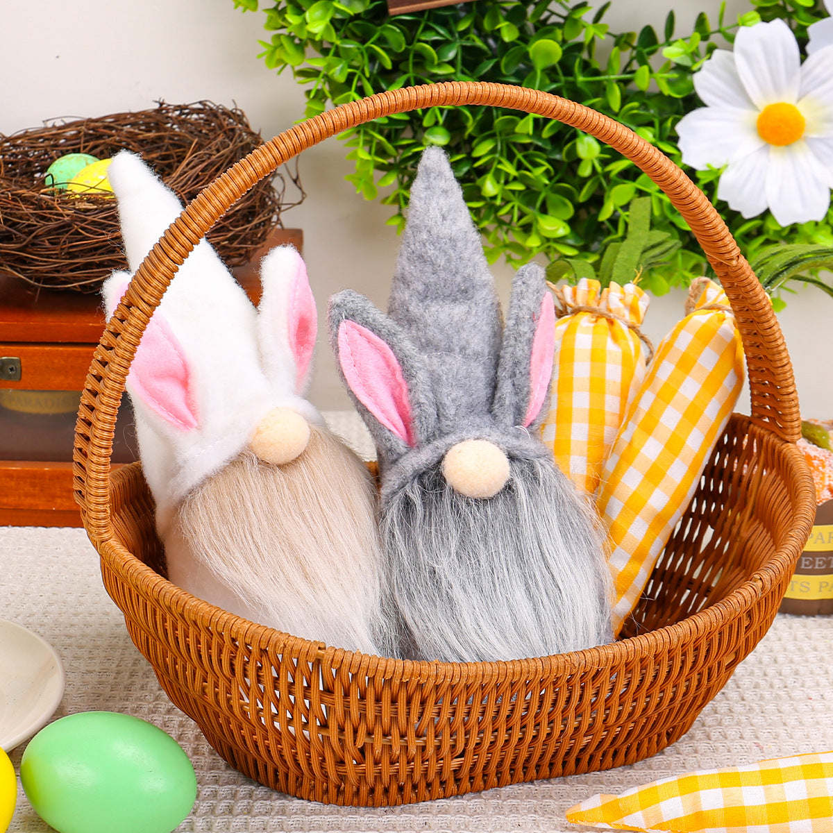 Easter gnome plush toys in a wicker basket, surrounded by festive yellow gingham carrots and pastel-colored eggs.